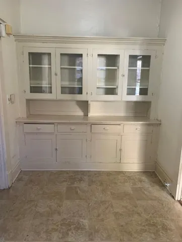 a view of cabinets and window