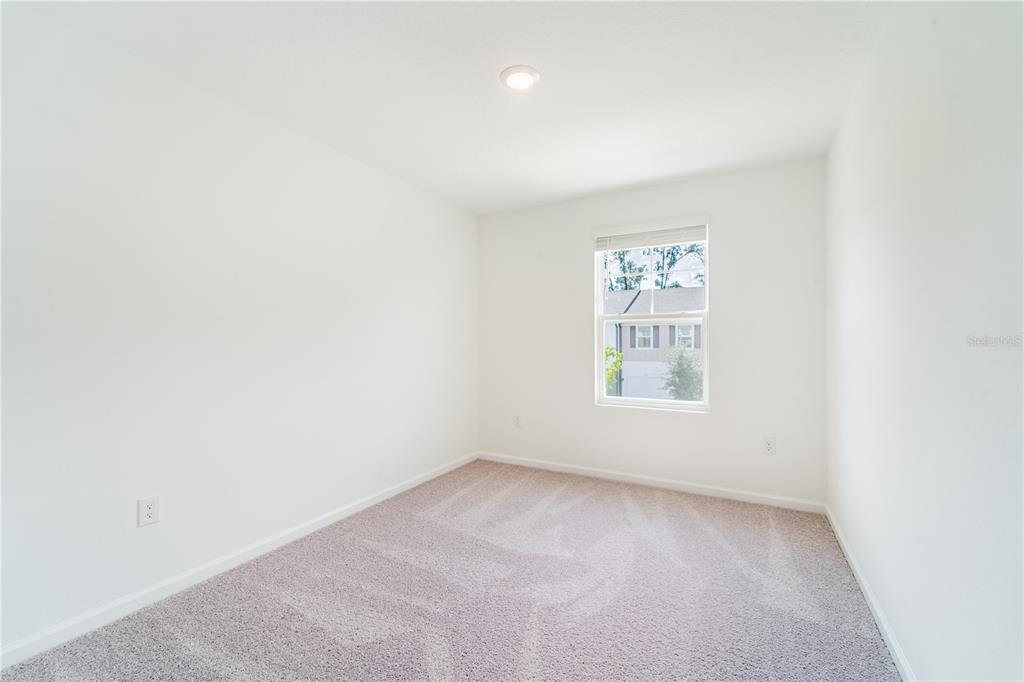 6174 Daerr Rdg Street Zephyrhills, FL 33542 - Photo 14 of 41 an empty room with a window