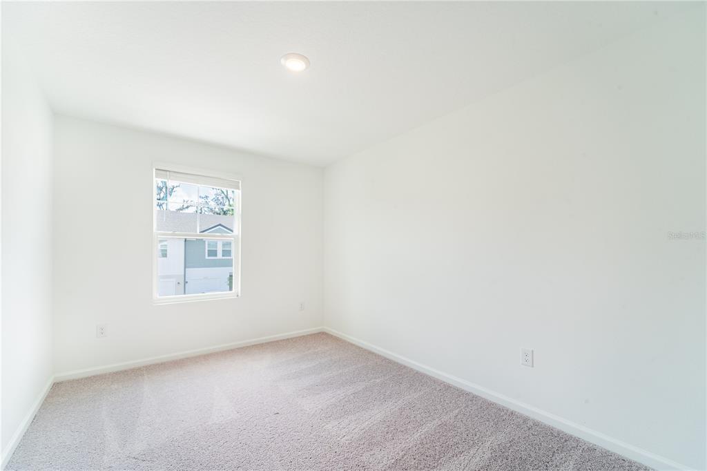 6174 Daerr Rdg Street Zephyrhills, FL 33542 - Photo 15 of 41 an empty room with a window