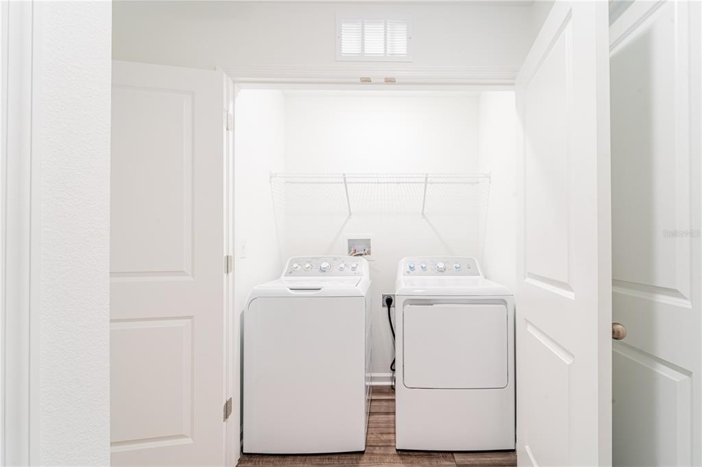 6174 Daerr Rdg Street Zephyrhills, FL 33542 - Photo 16 of 41 a utility room with dryer and washer
