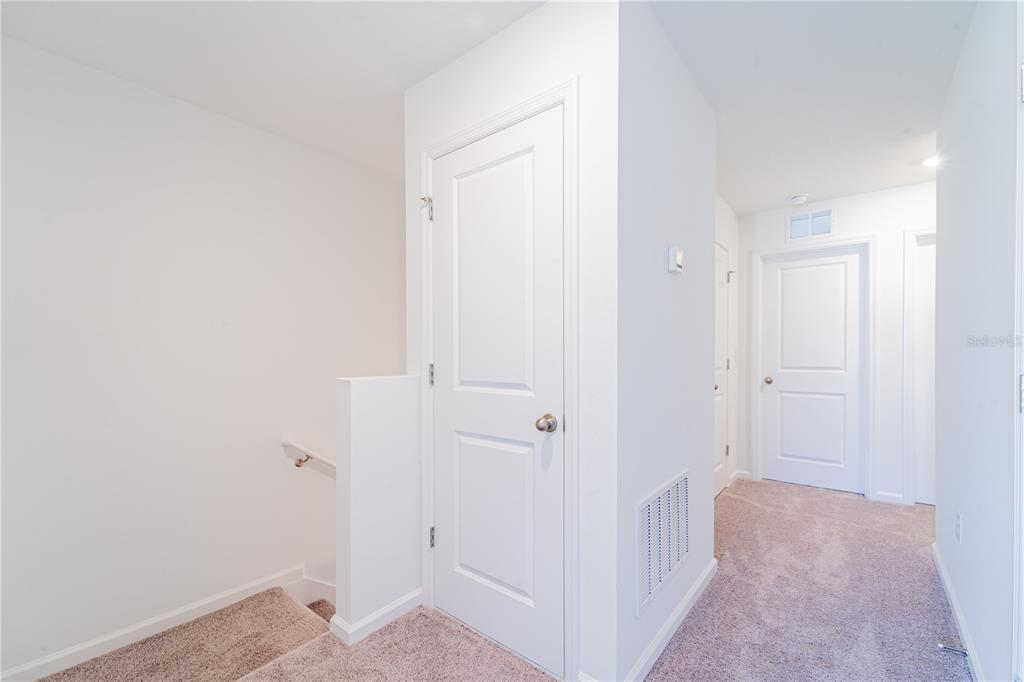 6174 Daerr Rdg Street Zephyrhills, FL 33542 - Photo 17 of 41 a view of hallway with closet