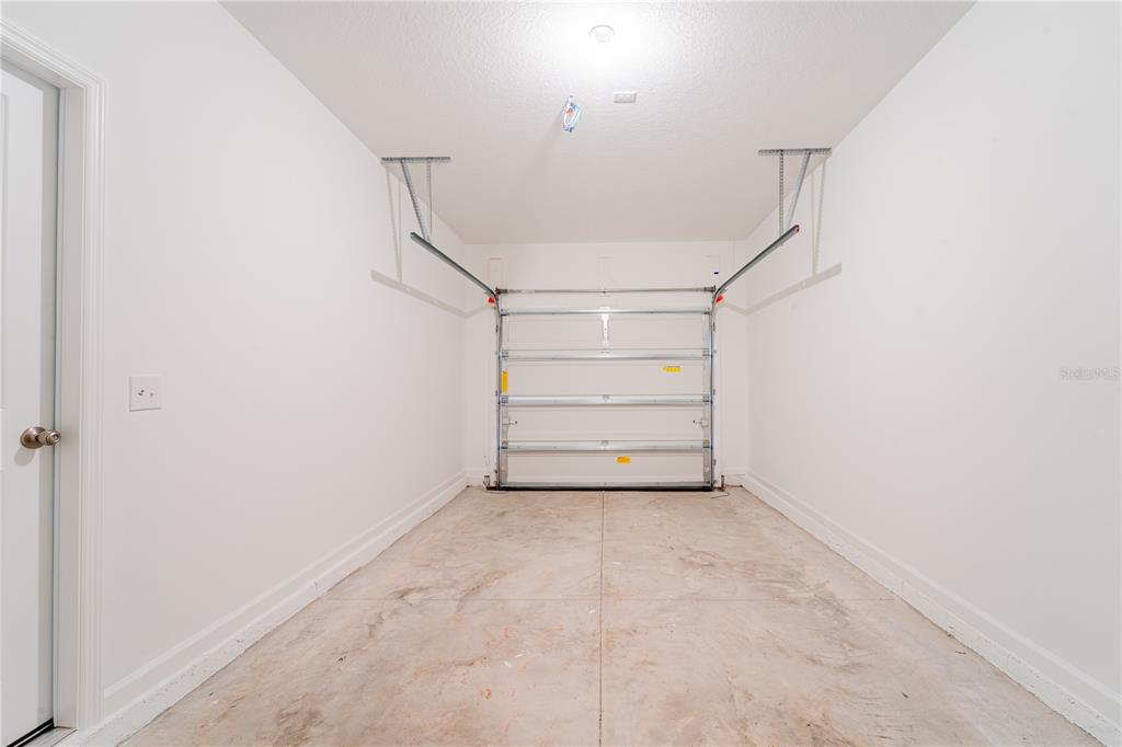 6174 Daerr Rdg Street Zephyrhills, FL 33542 - Photo 18 of 41 a view of an empty room