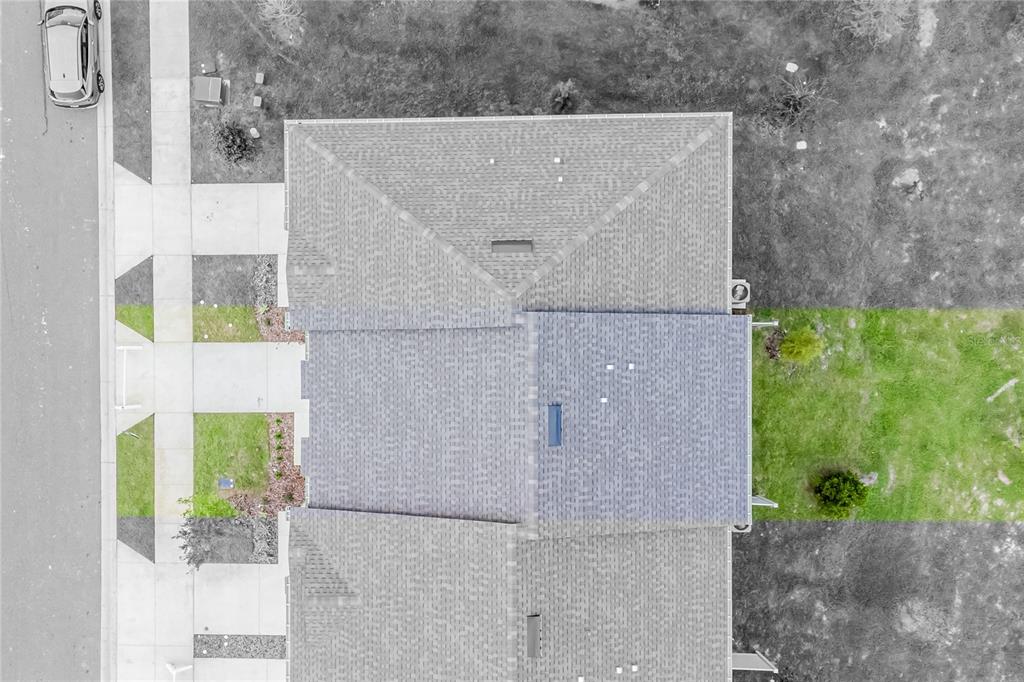 6174 Daerr Rdg Street Zephyrhills, FL 33542 - Photo 19 of 41 a aerial view of a house with a yard and plants