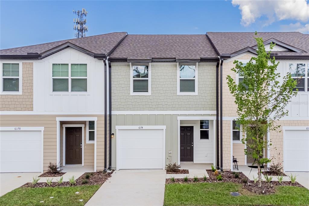 6174 Daerr Rdg Street Zephyrhills, FL 33542 - Photo 2 of 41 front view of a house with a yard