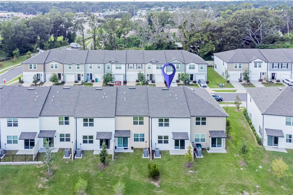 6174 Daerr Rdg Street Zephyrhills, FL 33542 - Photo 21 of 41 an aerial view of multiple houses with a yard