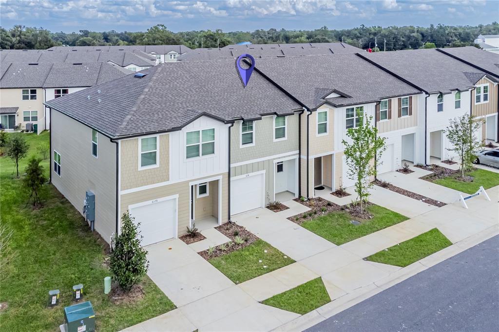 6174 Daerr Rdg Street Zephyrhills, FL 33542 - Photo 28 of 41 an aerial view of a house with a yard