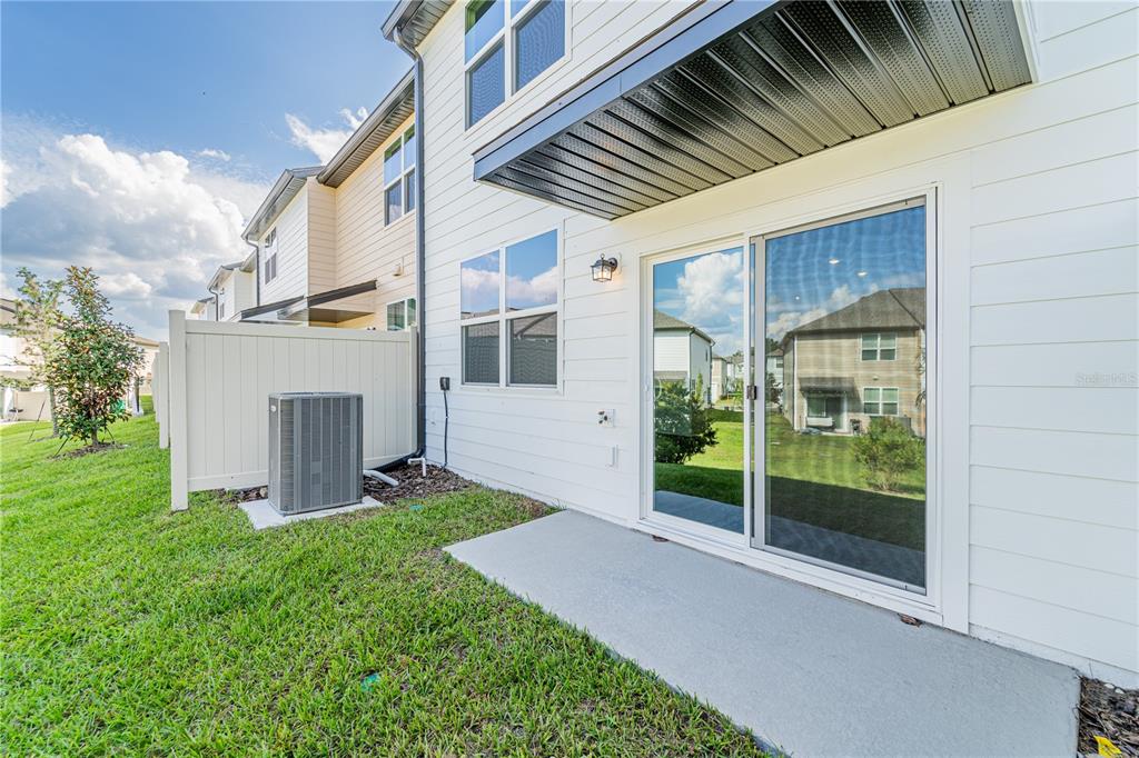6174 Daerr Rdg Street Zephyrhills, FL 33542 - Photo 31 of 41 a view of a porch in front of house