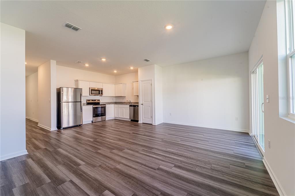 6174 Daerr Rdg Street Zephyrhills, FL 33542 - Photo 36 of 41 a view of kitchen with wooden floor