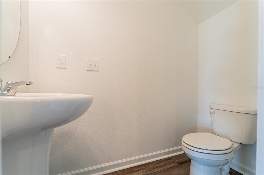 6174 Daerr Rdg Street Zephyrhills, FL 33542 - Photo 41 of 41 a bathroom with a sink and a toilet