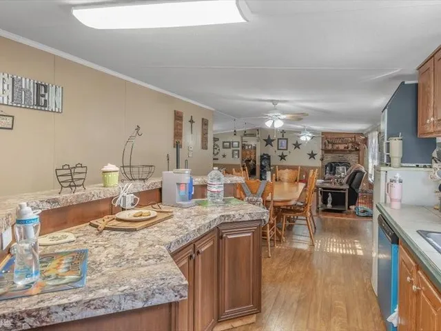 a backyard of a house with a yard with outdoor seating