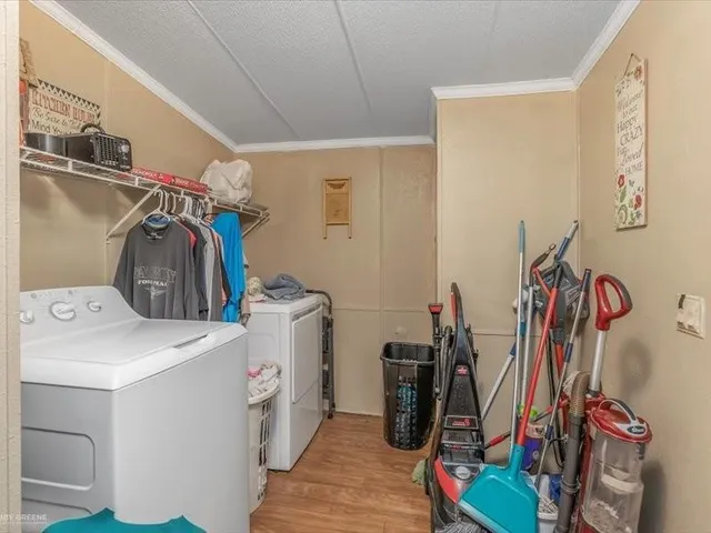 a room with a baby crib and a dresser