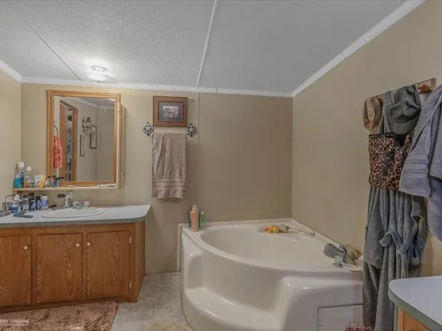 a view of storage and utility room with clothes