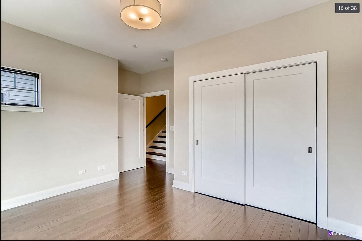 405 Duane Street Glen Ellyn, IL 60137 - Photo 8 of 12 a view of empty room with wooden floor