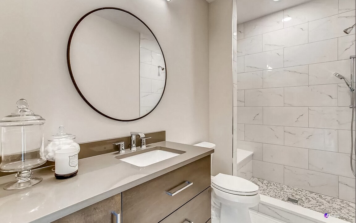 405 Duane Street Glen Ellyn, IL 60137 - Photo 10 of 12 a bathroom with a granite countertop sink and a mirror