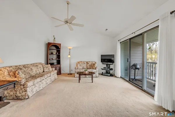 a living room with furniture and a window