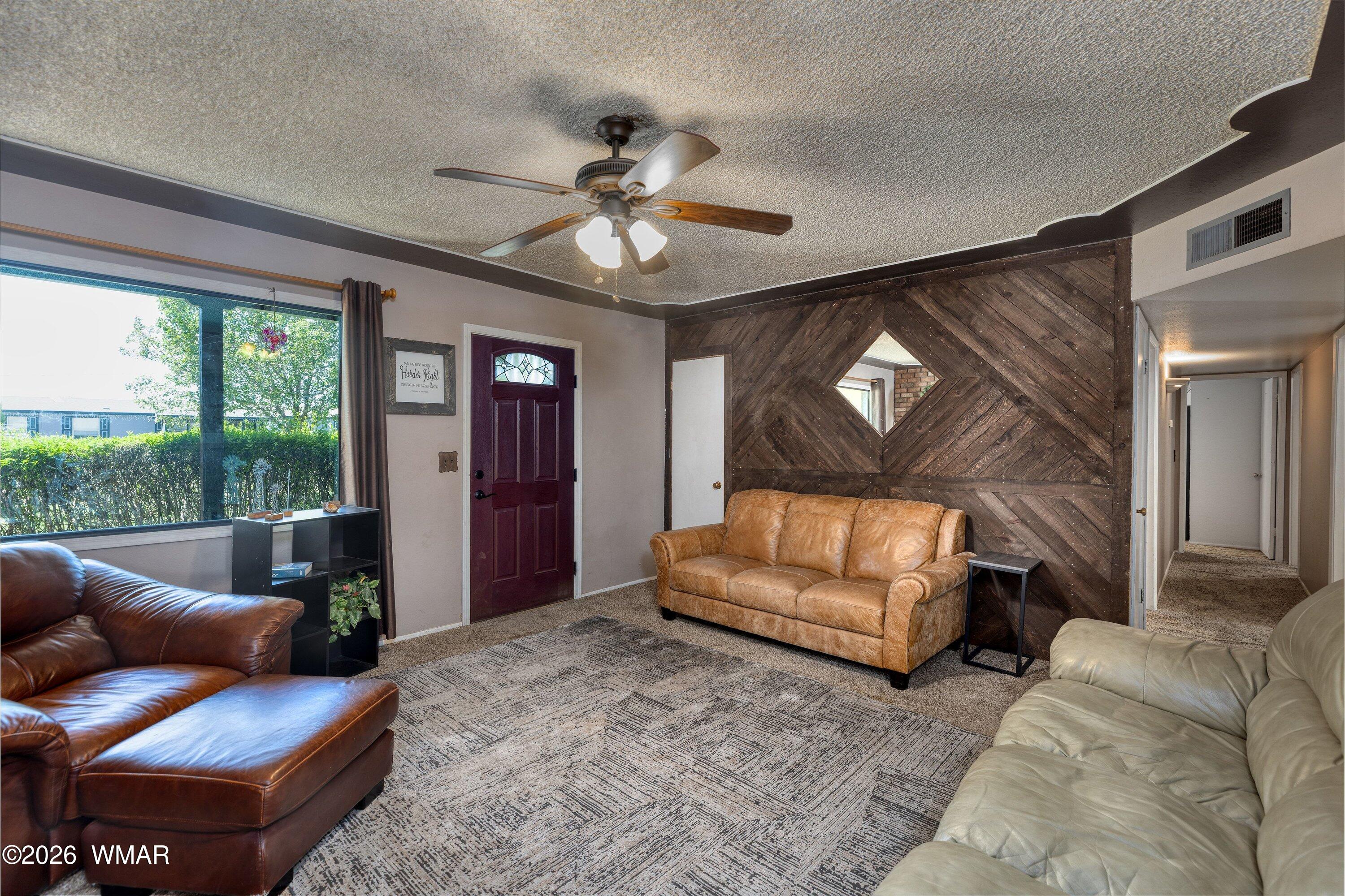 1114 Ranch Road Taylor, AZ 85939 - Photo 16 of 32 a living room with furniture and a large window