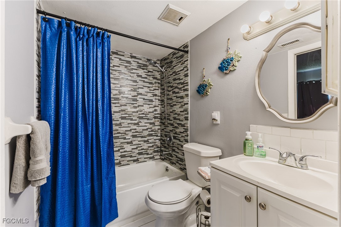 7393 Albany Road Fort Myers, FL 33967 - Photo 15 of 37 a bathroom with a sink toilet and shower
