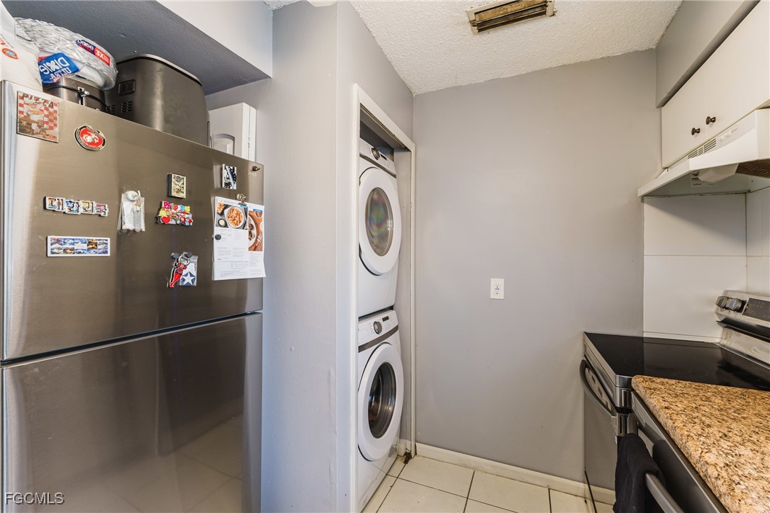 7393 Albany Road Fort Myers, FL 33967 - Photo 22 of 37 a utility room with dryer and washer