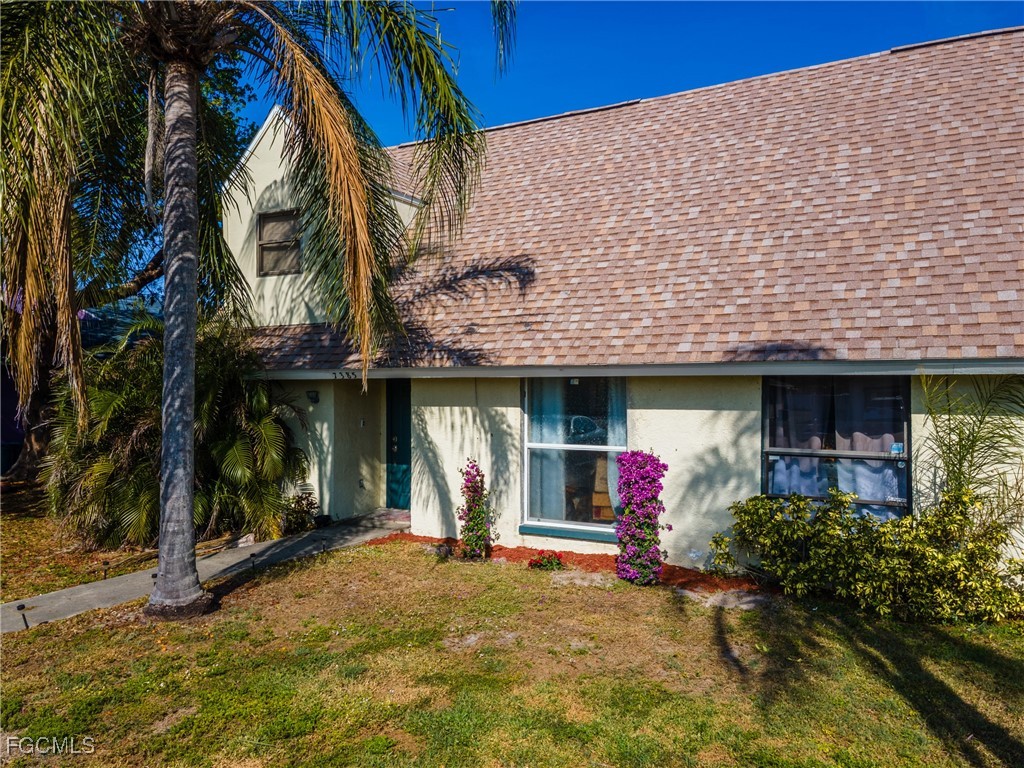 7393 Albany Road Fort Myers, FL 33967 - Photo 29 of 37 a front view of a house with yard