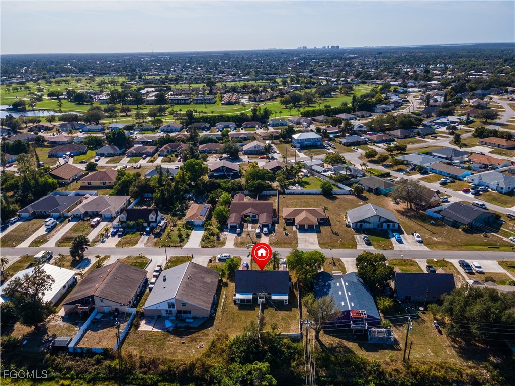 7393 Albany Road Fort Myers, FL 33967 - Photo 33 of 37 an aerial view of residential houses and city street