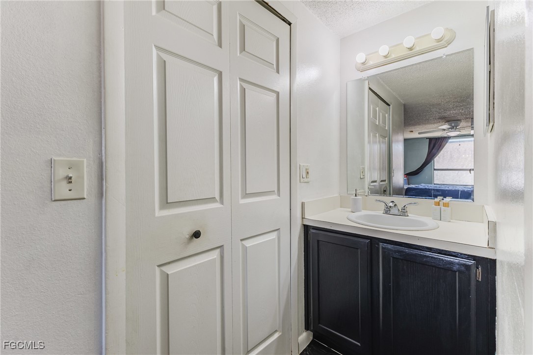 7393 Albany Road Fort Myers, FL 33967 - Photo 8 of 37 a bathroom with 2 sink and a mirror