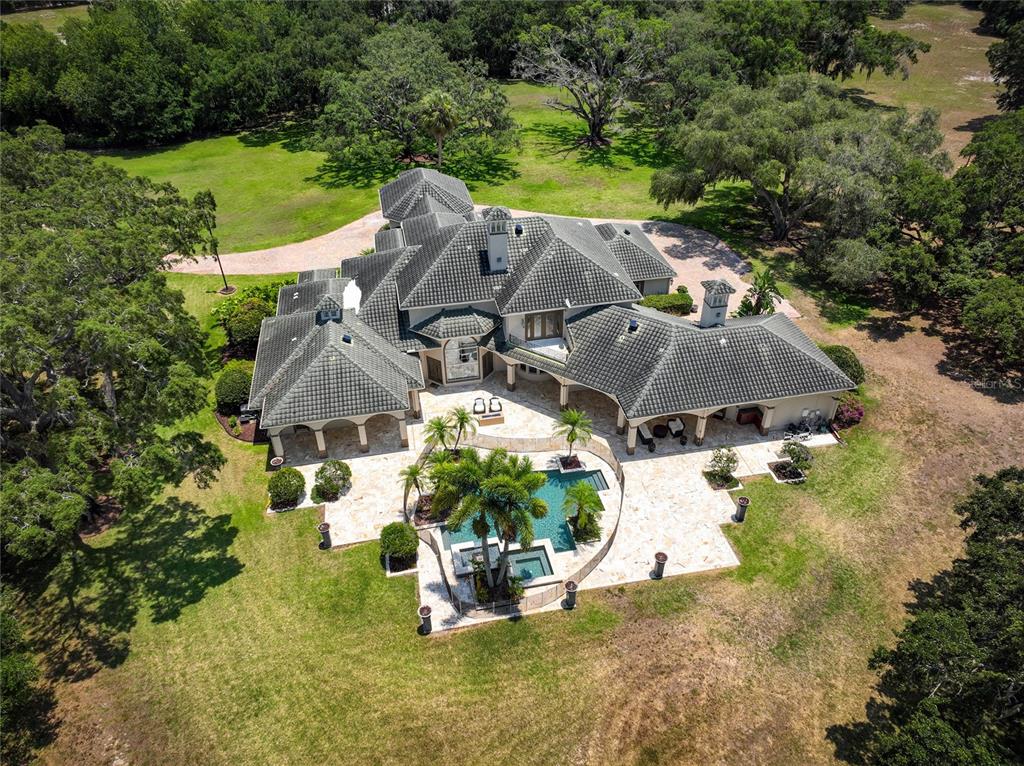 an aerial view of a house with a garden