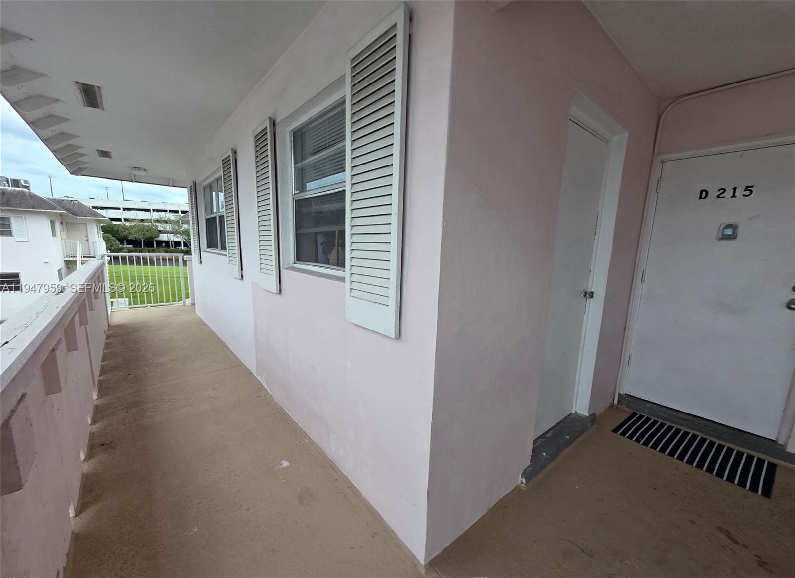 7424 Southwest 82nd Street, Unit D215 Miami, FL 33143 - Photo 11 of 33 a view of hallway with a kitchen