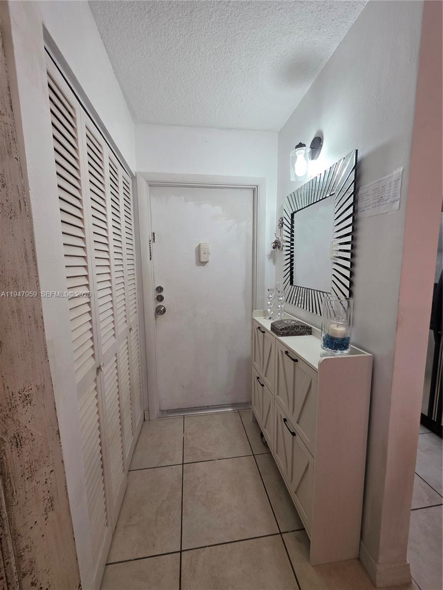 7424 Southwest 82nd Street, Unit D215 Miami, FL 33143 - Photo 14 of 33 a room with a washer and dryer