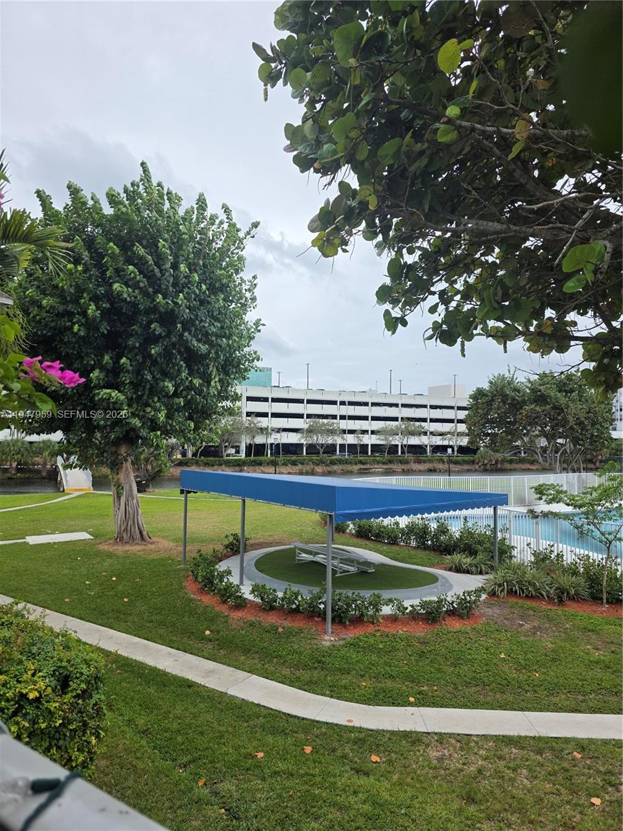 7424 Southwest 82nd Street, Unit D215 Miami, FL 33143 - Photo 3 of 33 a view of a house with a big yard