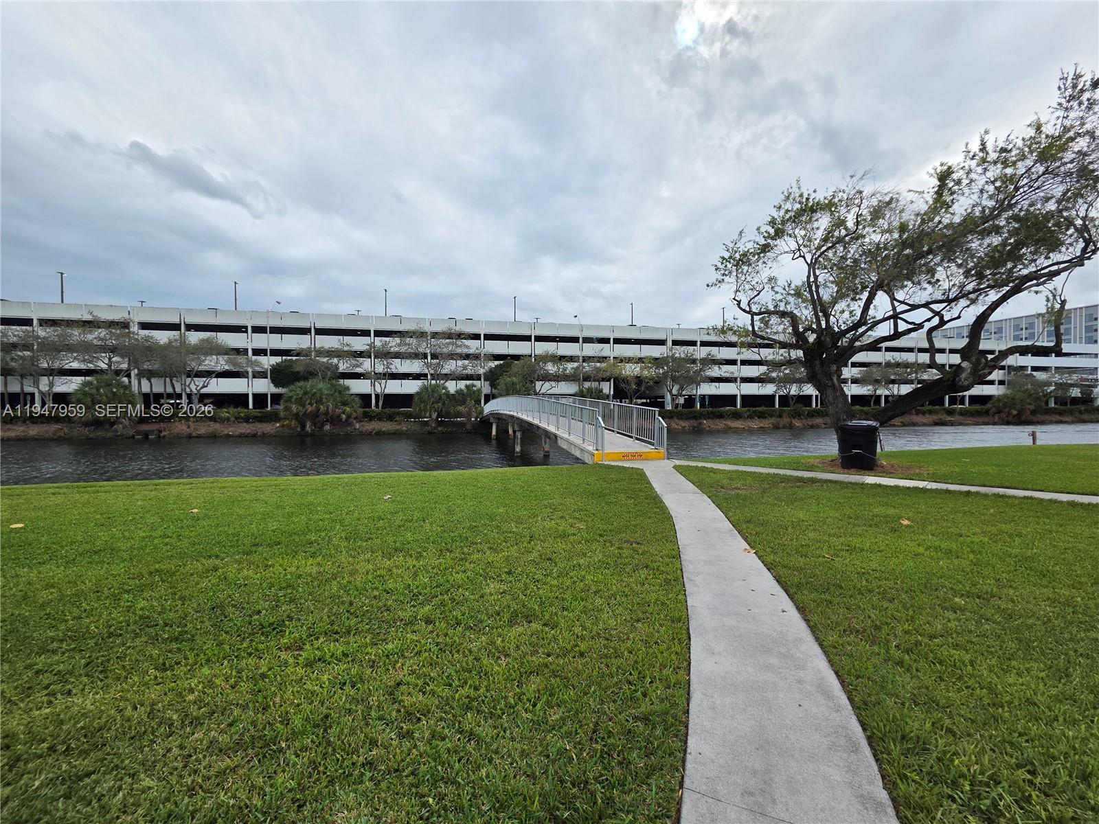 7424 Southwest 82nd Street, Unit D215 Miami, FL 33143 - Photo 31 of 33 a view of a garden with lawn chairs