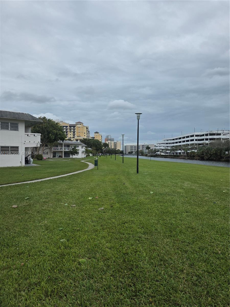 7424 Southwest 82nd Street, Unit D215 Miami, FL 33143 - Photo 33 of 33 a view of a golf course with a park