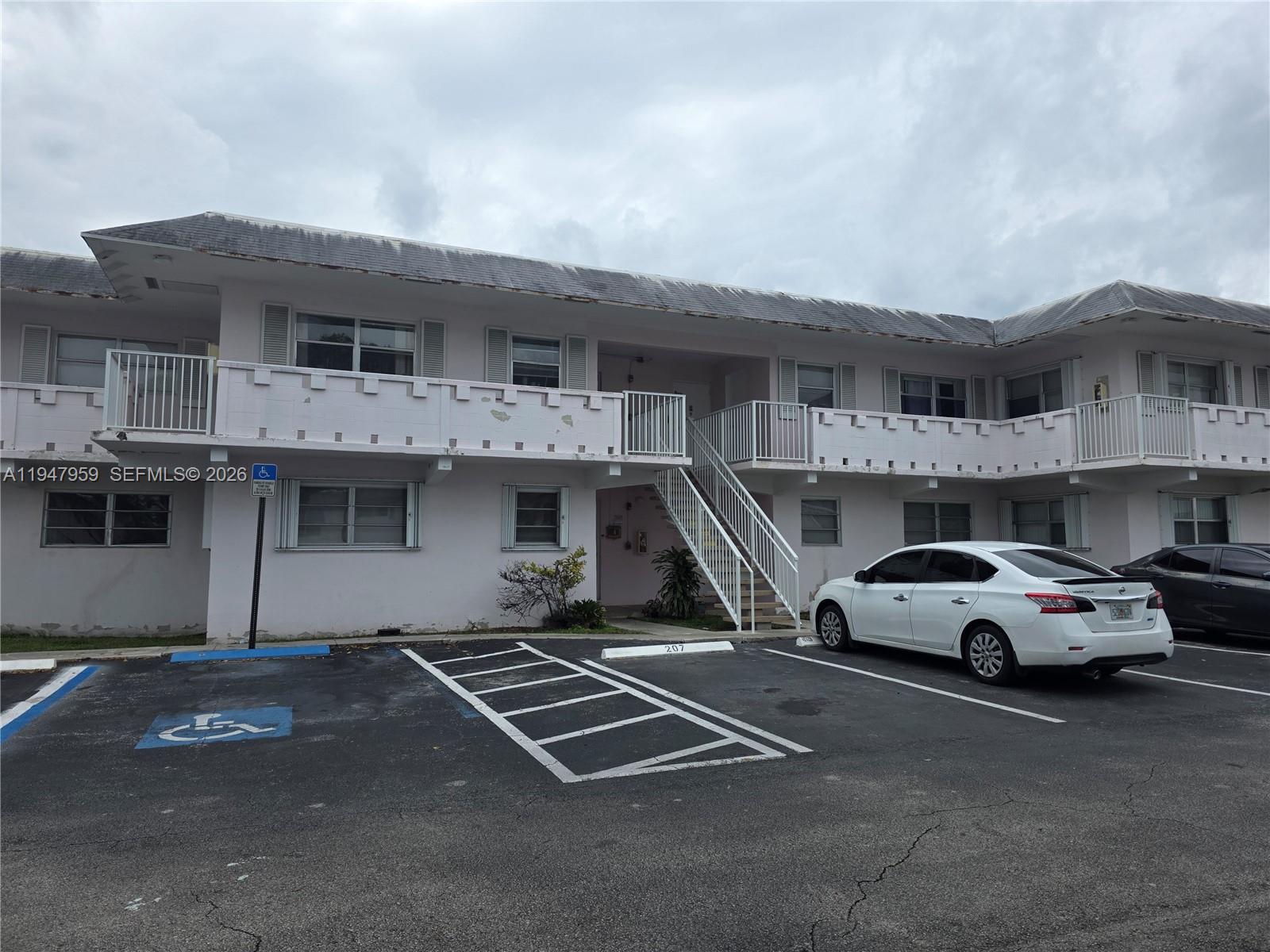 7424 Southwest 82nd Street, Unit D215 Miami, FL 33143 - Photo 6 of 33 a car parked in front of a building