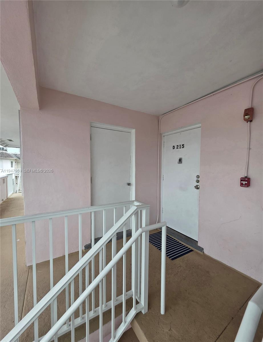 7424 Southwest 82nd Street, Unit D215 Miami, FL 33143 - Photo 9 of 33 a view of an empty room with wooden floor