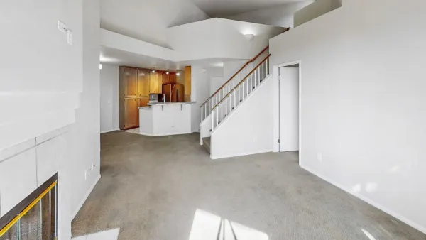 a view of a hallway with staircase