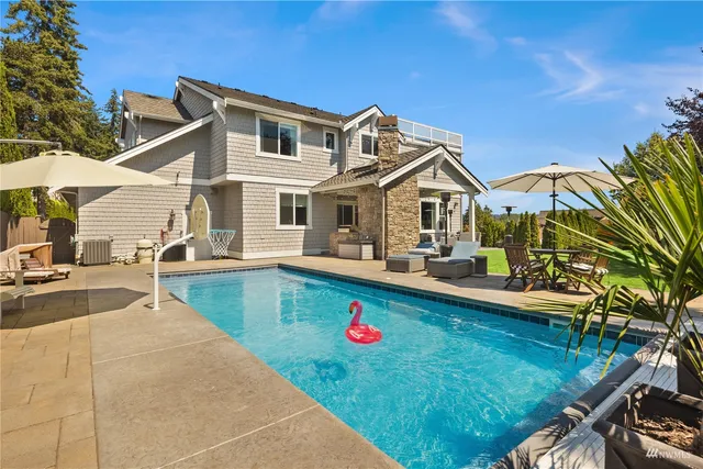 a view of a house with swimming pool