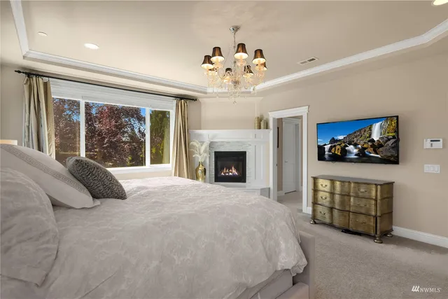 a bathroom with double vanity sinks and a shower