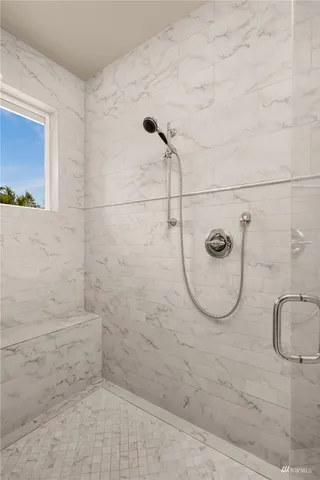 a bed room with a bed and a window