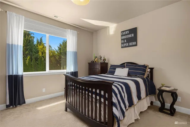 a bathroom with a sink a light fixture and a toilet
