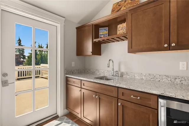 a view of a chair and table on the roof deck