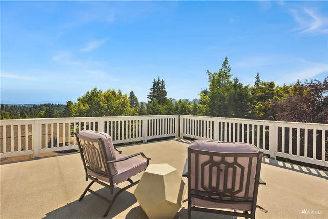 a view of a backyard with swimming pool