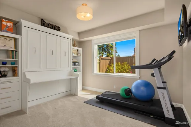 a view of a house with a yard and sitting area