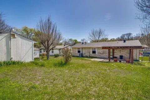 a front view of house with yard and seating area
