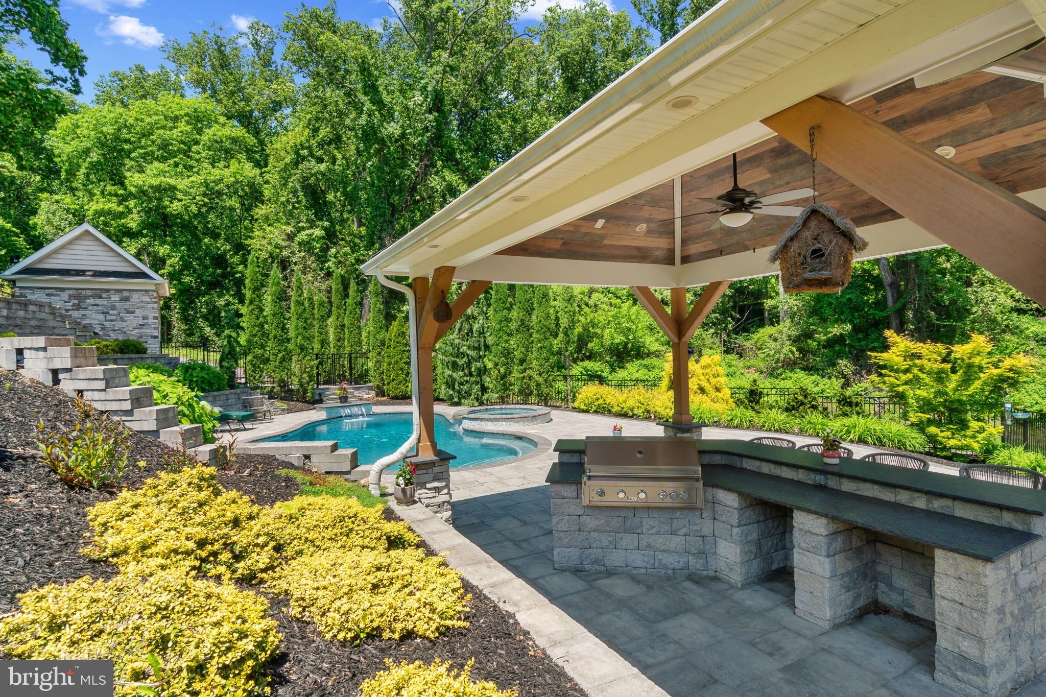 10907 Hollow Road Cockeysville, MD 21030 - Photo 46 of 57 a view of a patio with table and chairs potted plants with wooden floor and fence