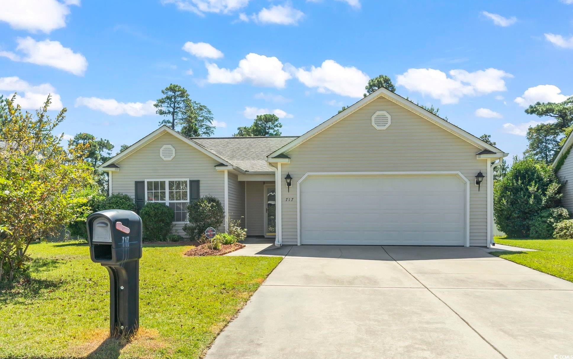 717 West Perry Road Myrtle Beach, SC 29579 - Photo 1 of 29 Ranch-style house with a front yard, an attached garage, and driveway