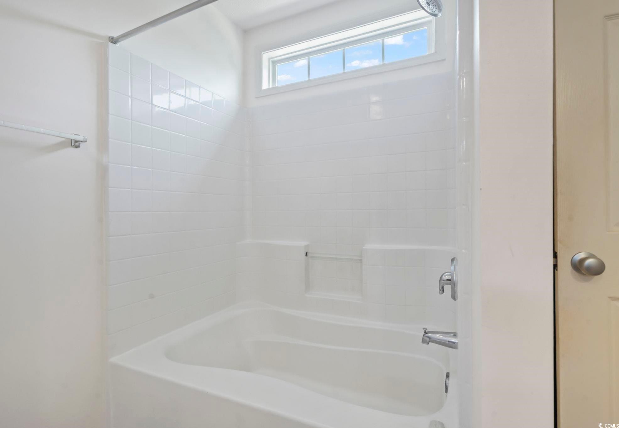 717 West Perry Road Myrtle Beach, SC 29579 - Photo 16 of 29 Owner's bathroom featuring shower/bathtub combination