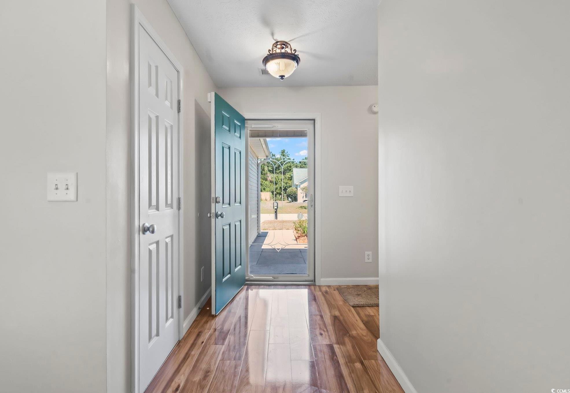 717 West Perry Road Myrtle Beach, SC 29579 - Photo 17 of 29 Entryway featuring baseboards and wood finished floors