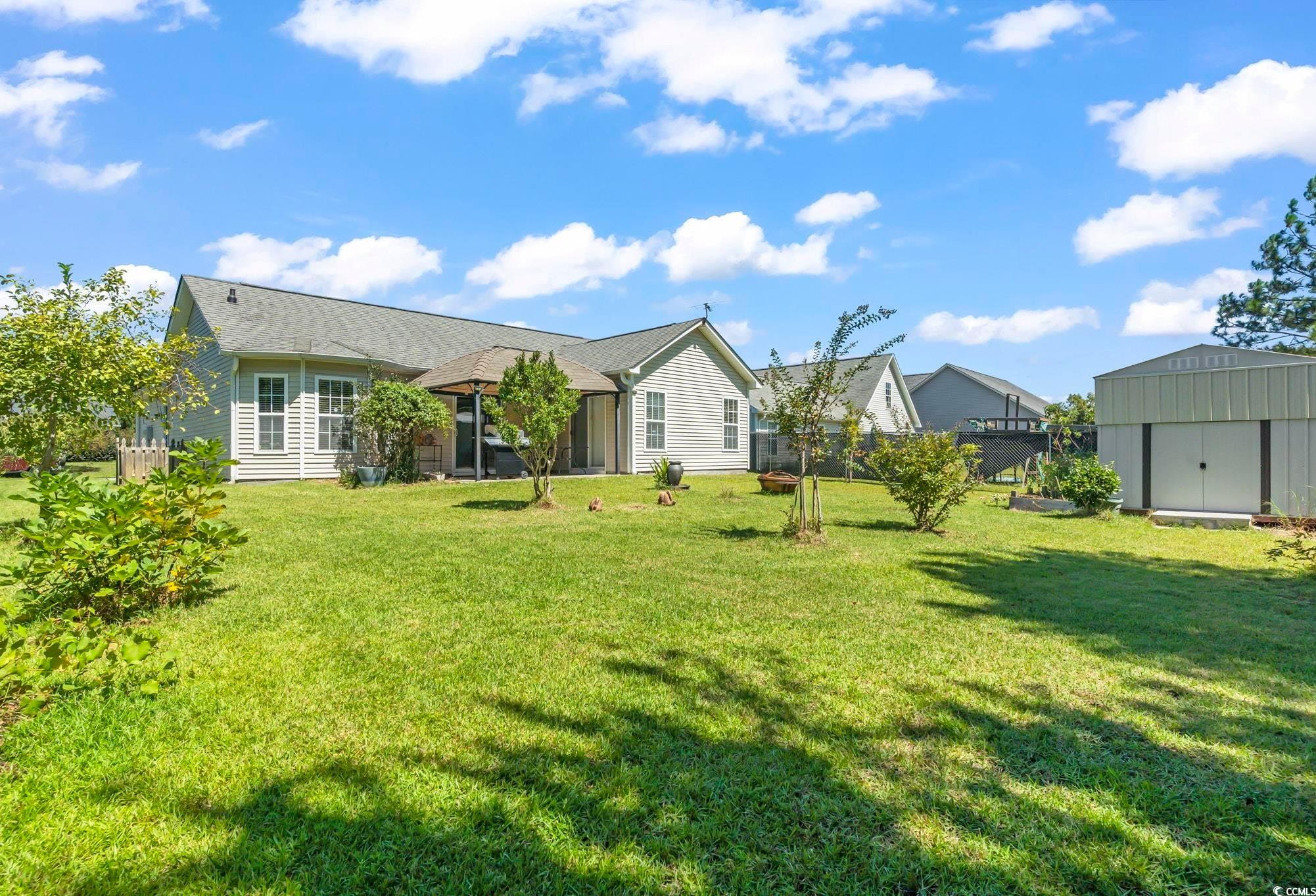 717 West Perry Road Myrtle Beach, SC 29579 - Photo 27 of 29 Back of property with a storage unit