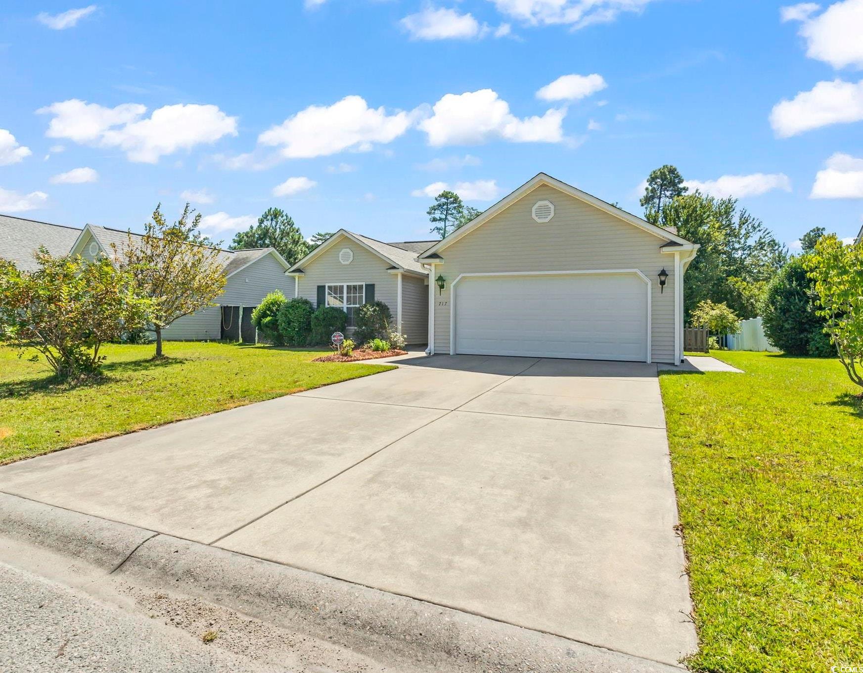 717 West Perry Road Myrtle Beach, SC 29579 - Photo 28 of 29 Ranch-style house featuring concrete driveway, a front yard, and a garage