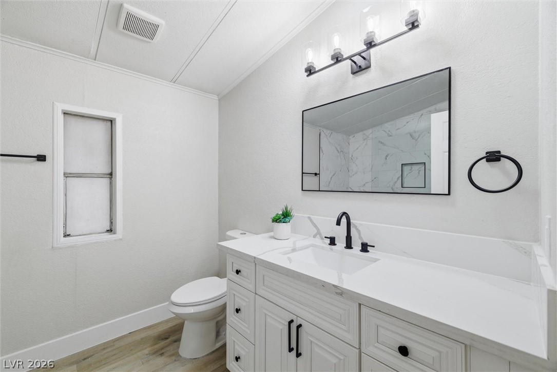 3940 Point Drive Pahrump, NV 89060 - Photo 23 of 35 A well-appointed bath features a sleek vanity with ample counter space and a modern mirror.