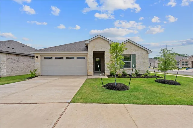 a house view with a garden space